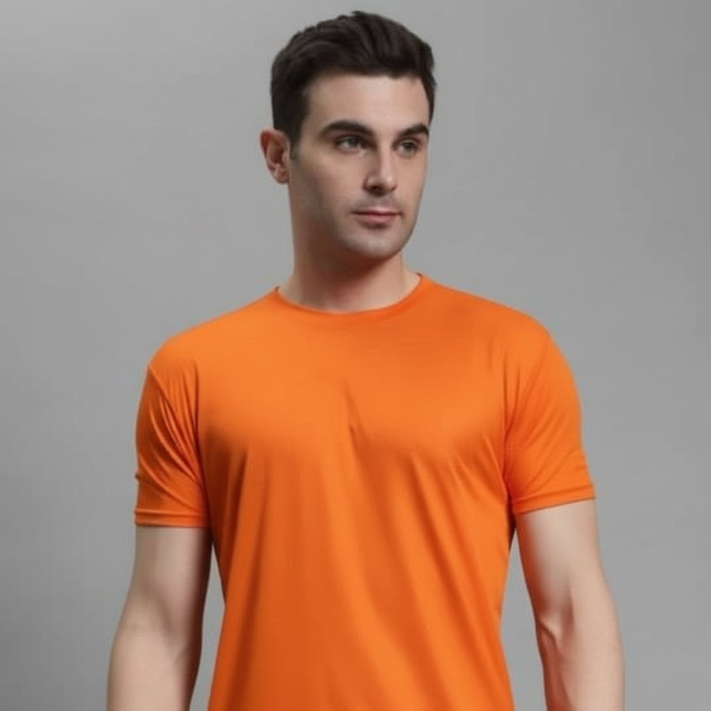 Man wearing an orange t-shirt against a gray background